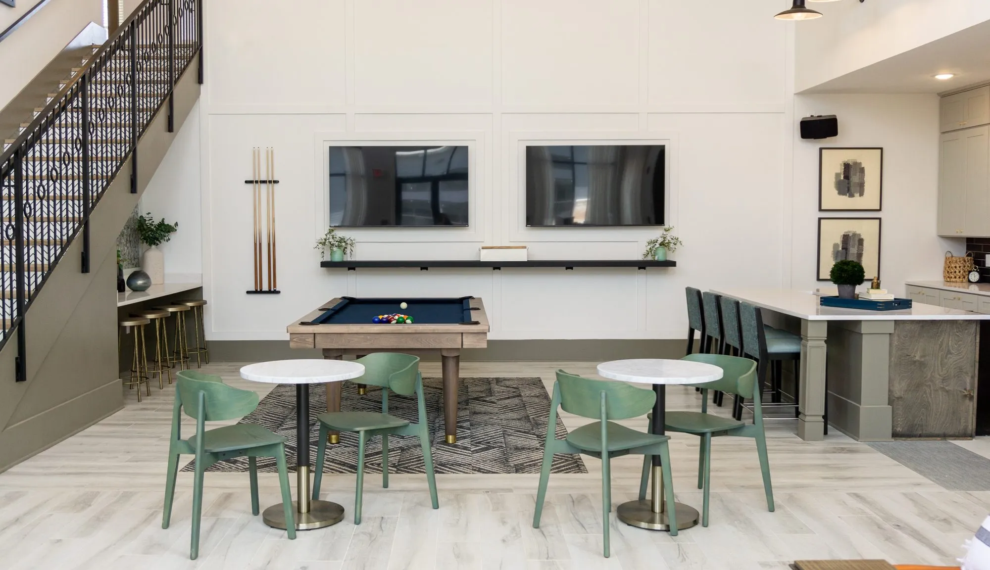 Multifamily amenity clubroom with a billiards table and sage cafe chairs, interior design by Banko Design at Crest at Acworth, Acworth, Georgia
