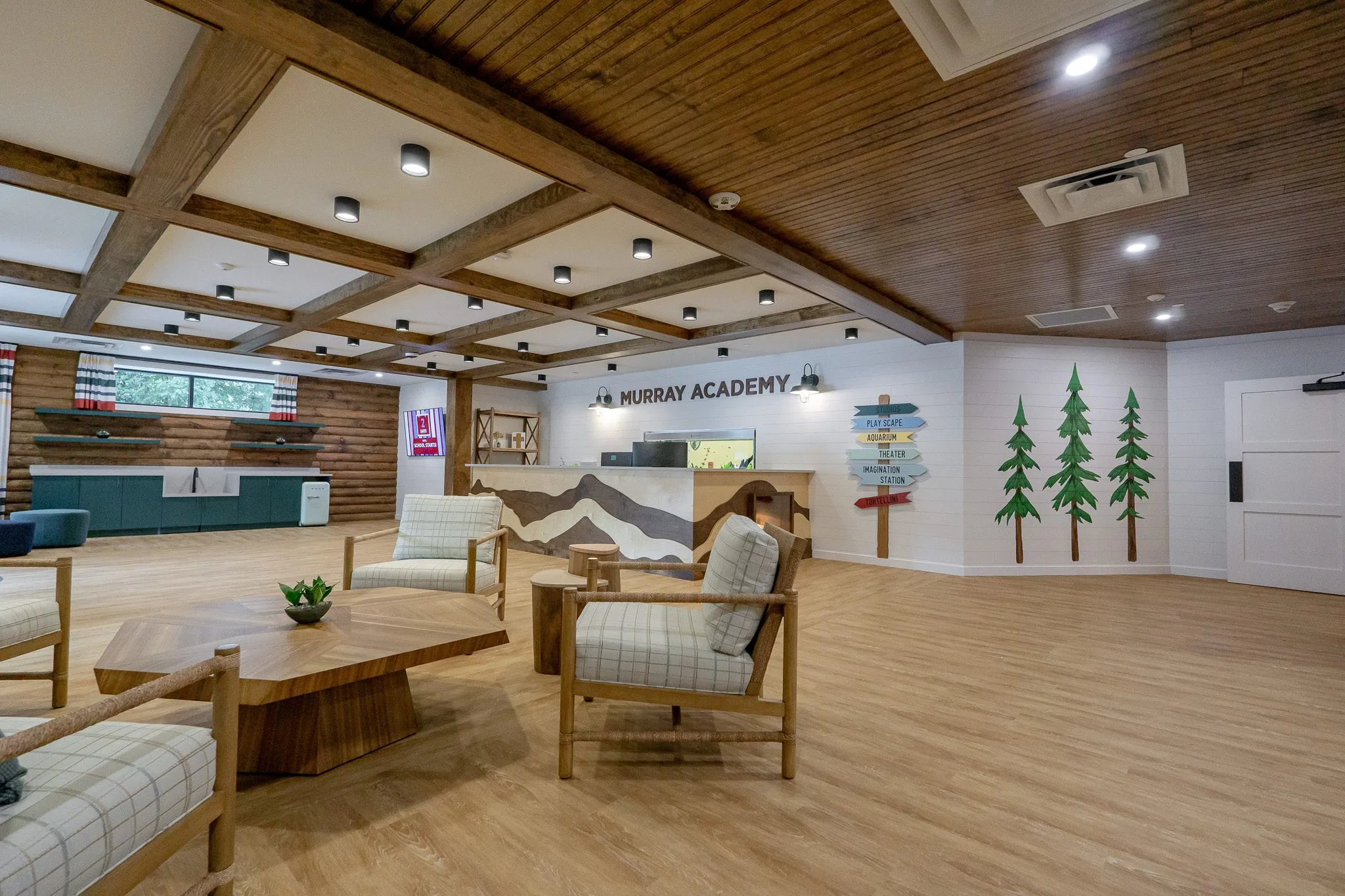 School lobby with a rough timber coffered ceiling and plaid armchairs, interior design by Banko Design at Mount Pisgah Christian School, Johns Creek, Georgia