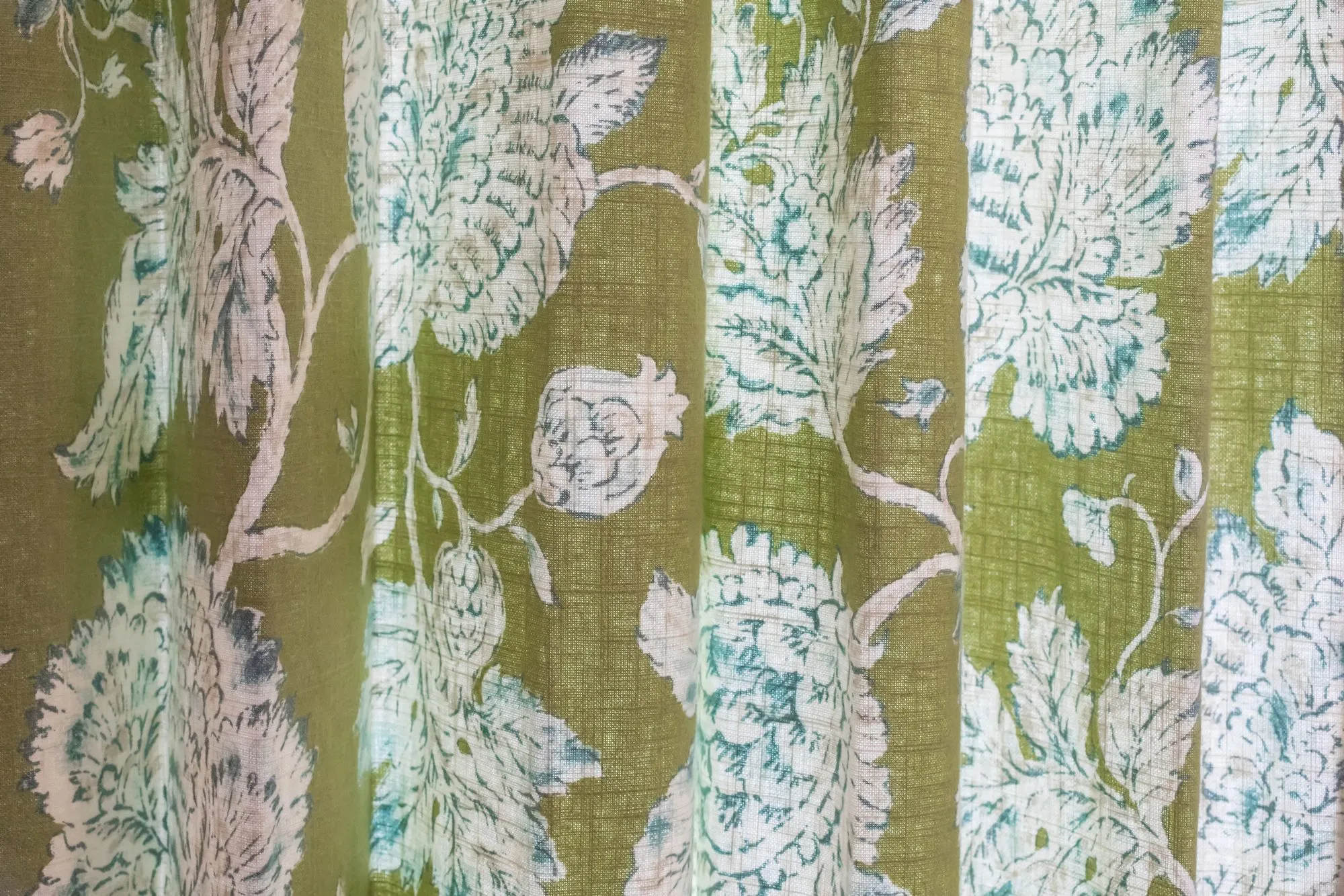 Senior living interior detail: drapery in a green and white floral print