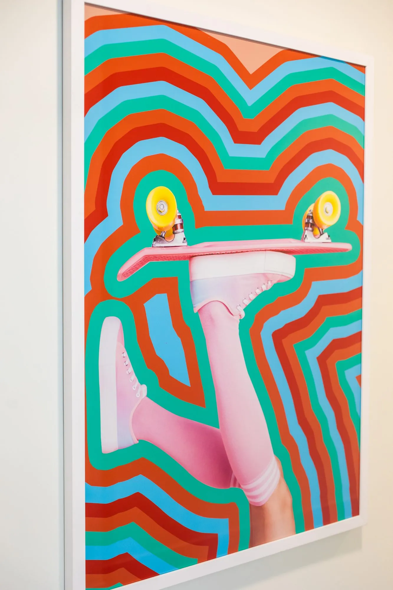 Student housing interior detail: pop art print of pink socks and a skateboard, interior design by Banko Design at Relato Apartments, Bloomington, Indiana
