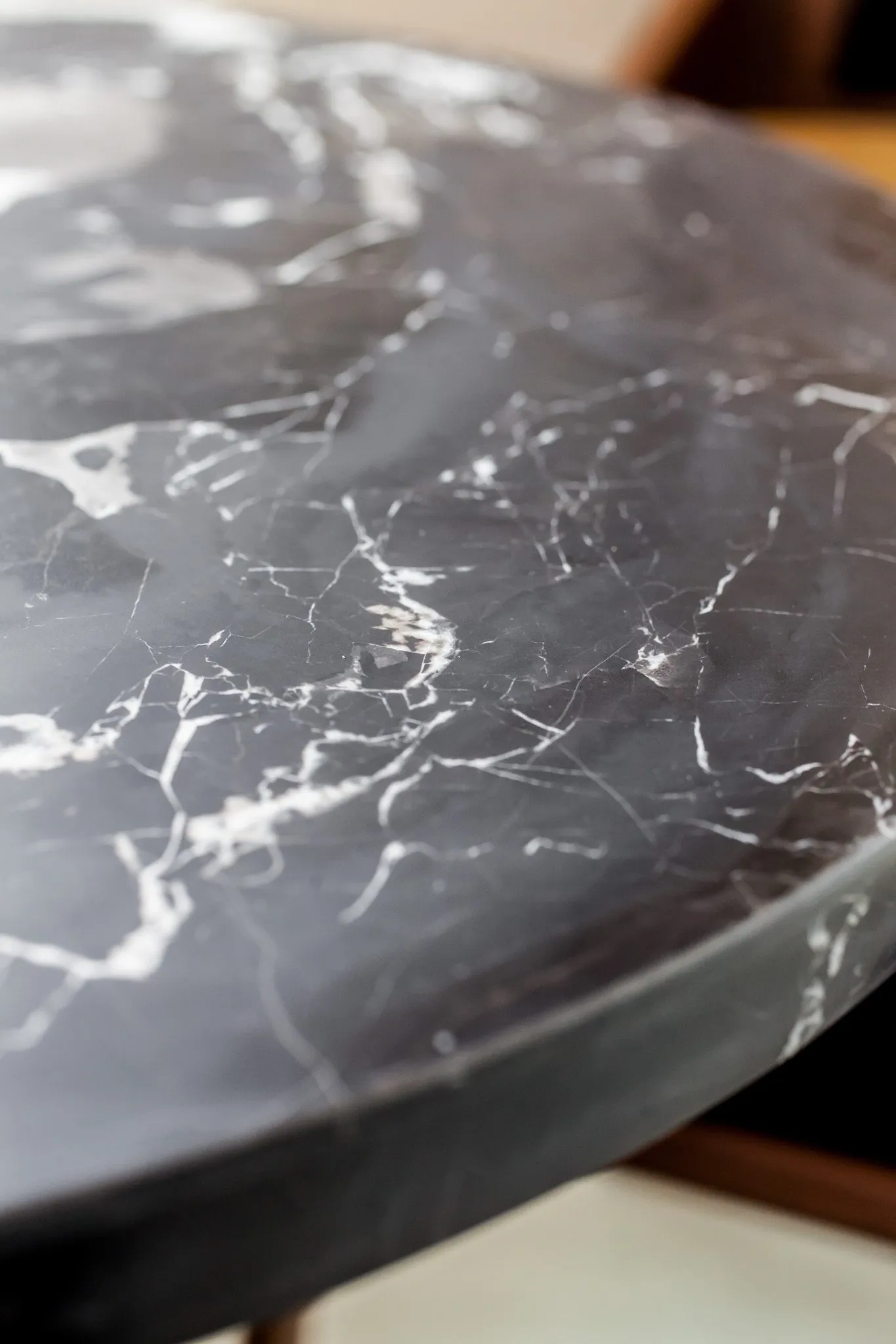 Multifamily interior detail: black marble table top with white veining