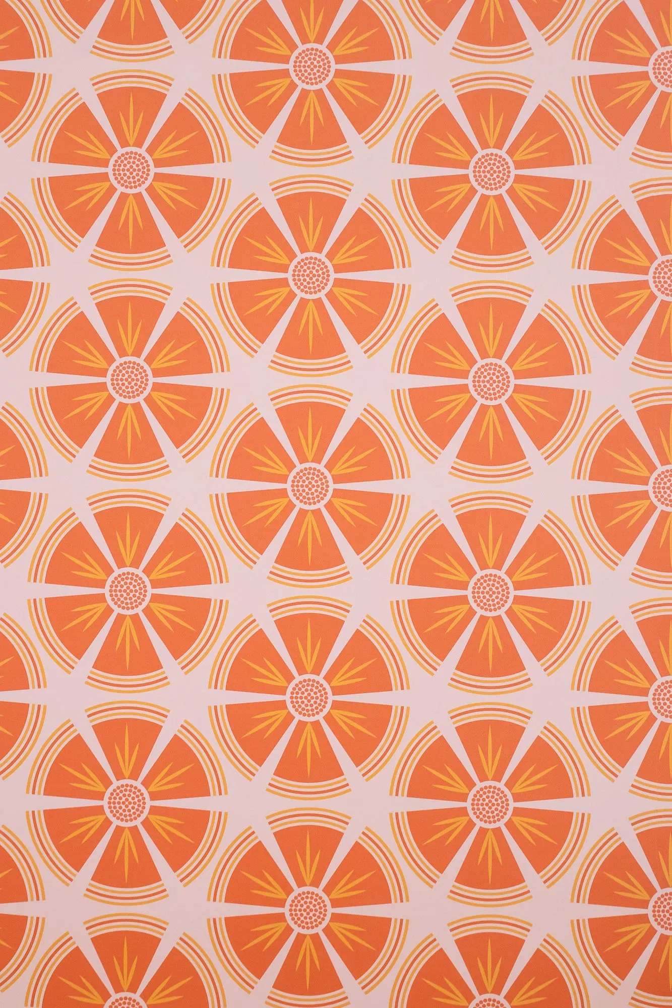 Multifamily interior detail: wallpaper patterned with orange citrus slices on blush