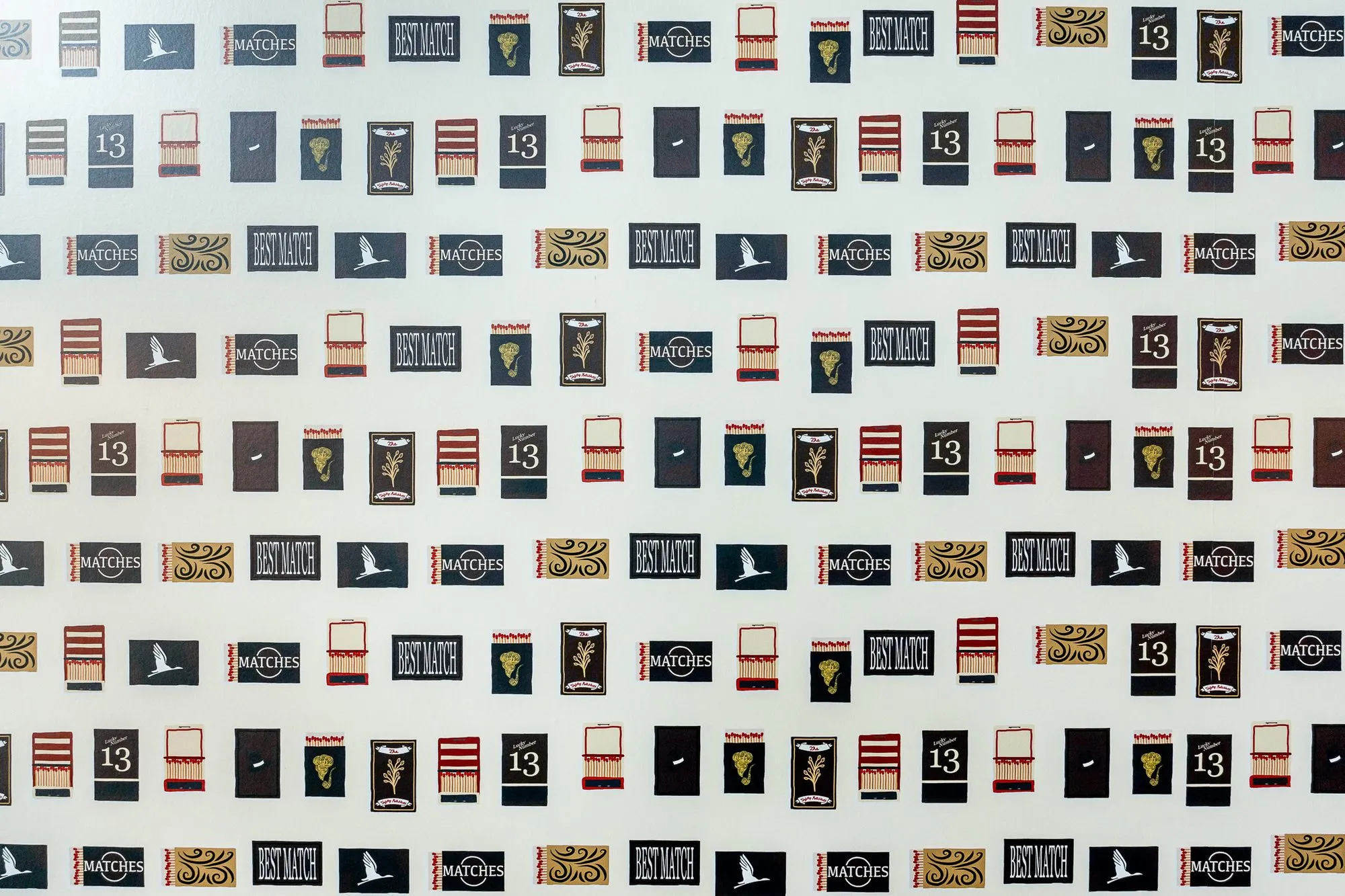 Multifamily amenity clubroom wallpaper patterned with vintage matchbook covers