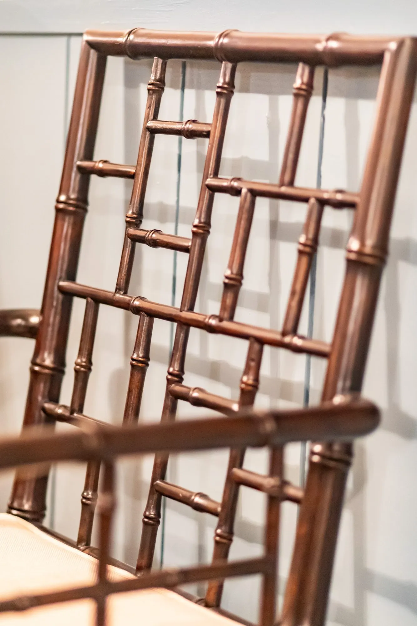 Senior living interior detail: bronze faux bamboo lattice chair back