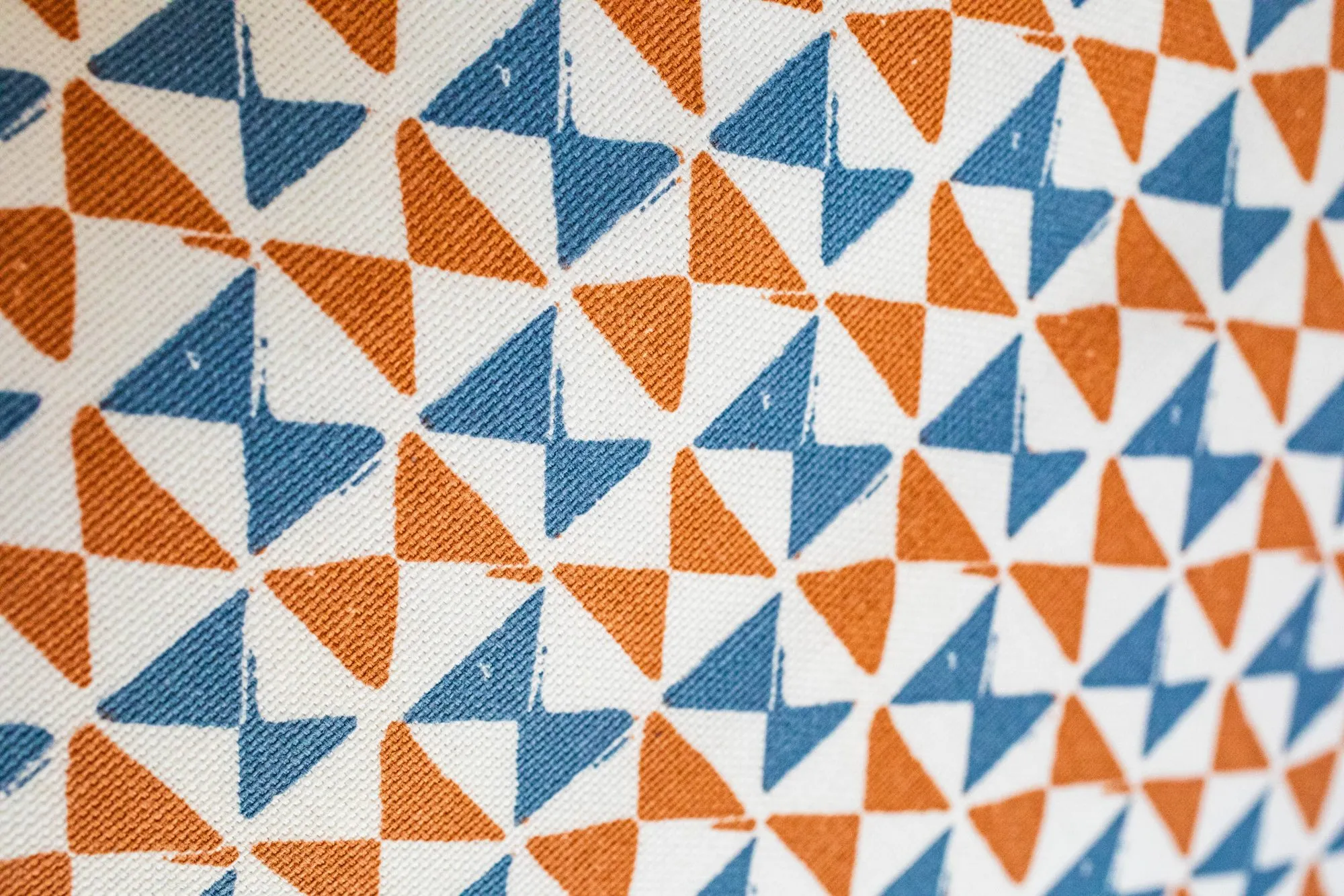 Senior living interior detail: fabric with an orange and blue triangle pattern