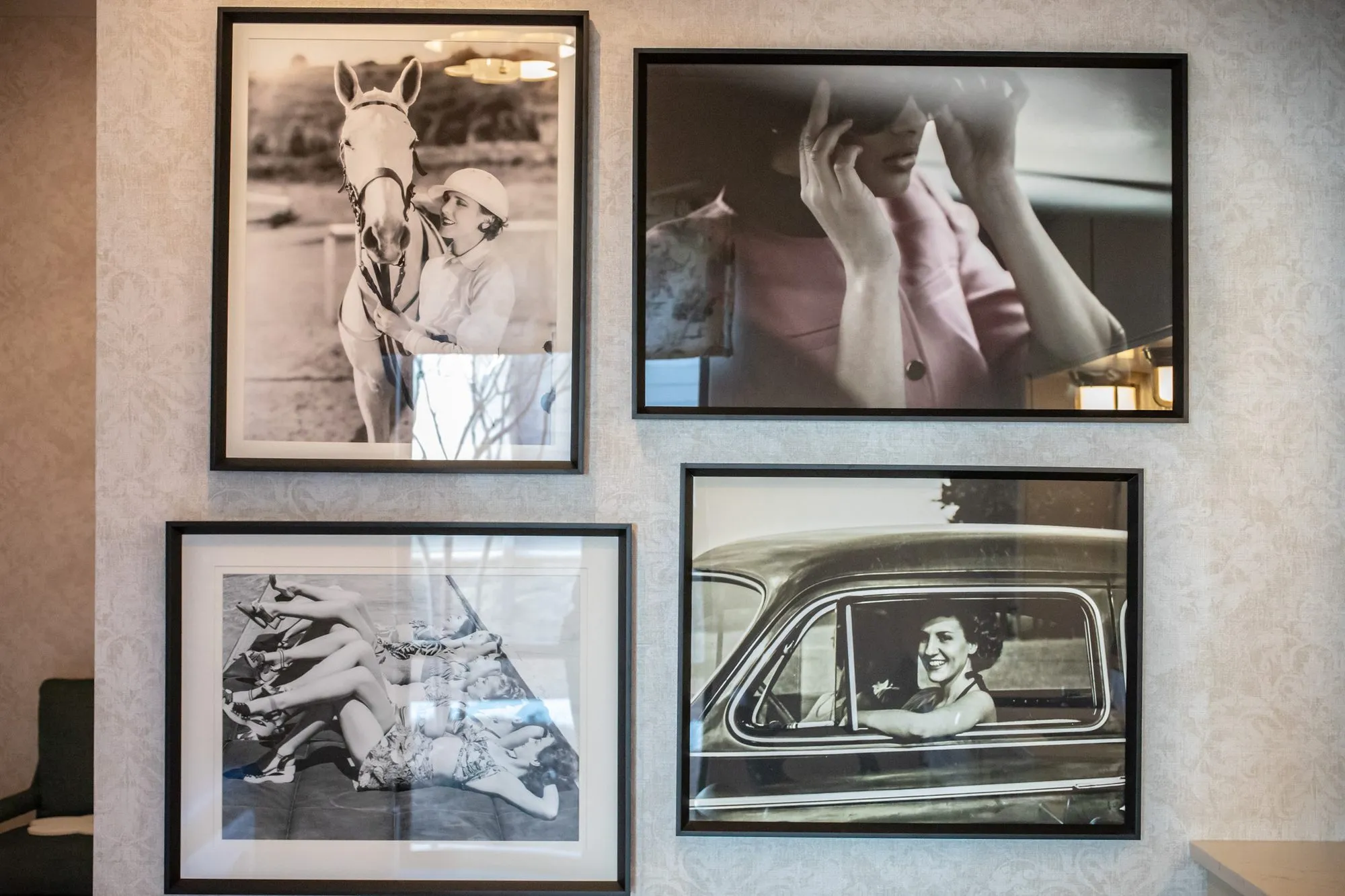 Senior living interior detail: four black and white photographs, a woman with a horse and a woman driving a car