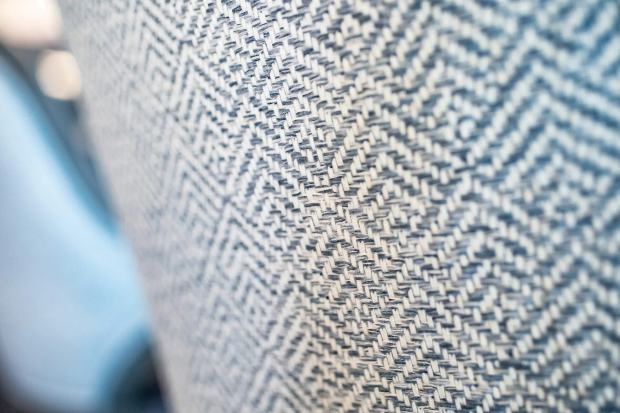 Senior living interior detail: blue and white herringbone upholstery