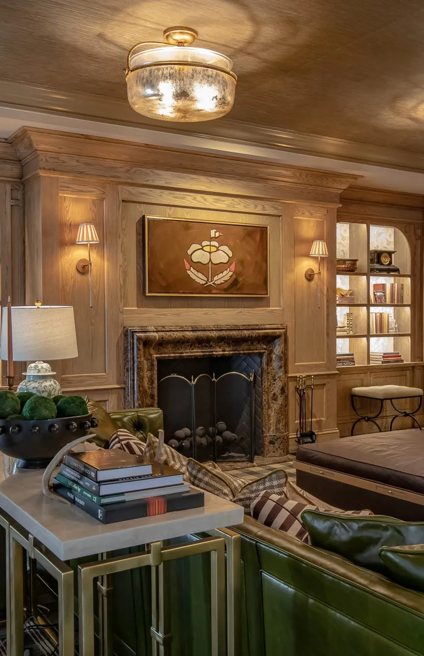 Private club library with lit shelving flanking a marble fireplace, interior design by Banko Design at The Rose Downtown Club, Athens, Georgia