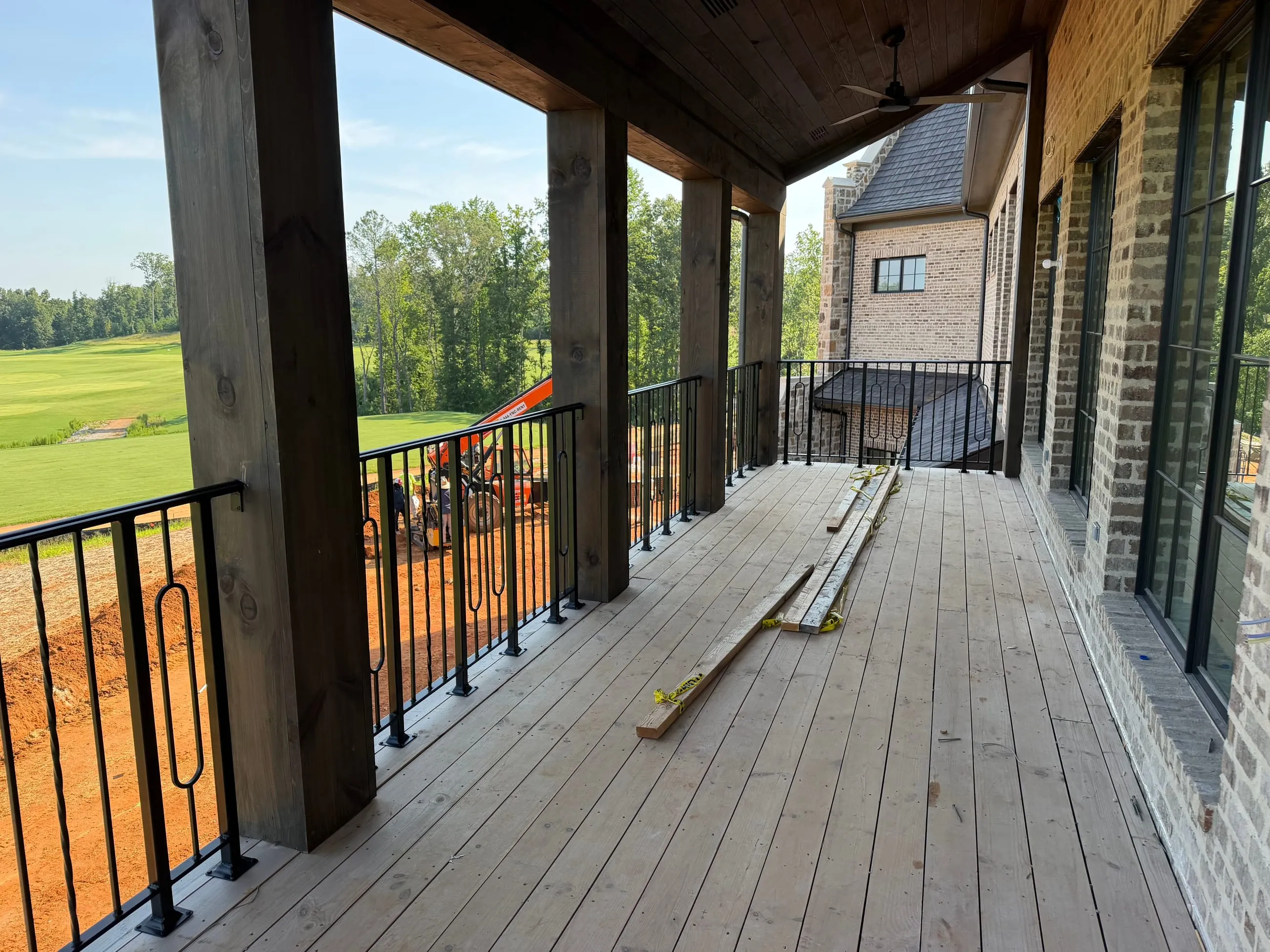 Private club clubhouse under construction, covered deck over the fairway, interior design by Banko Design at The Rose Golf Club, Athens, Georgia