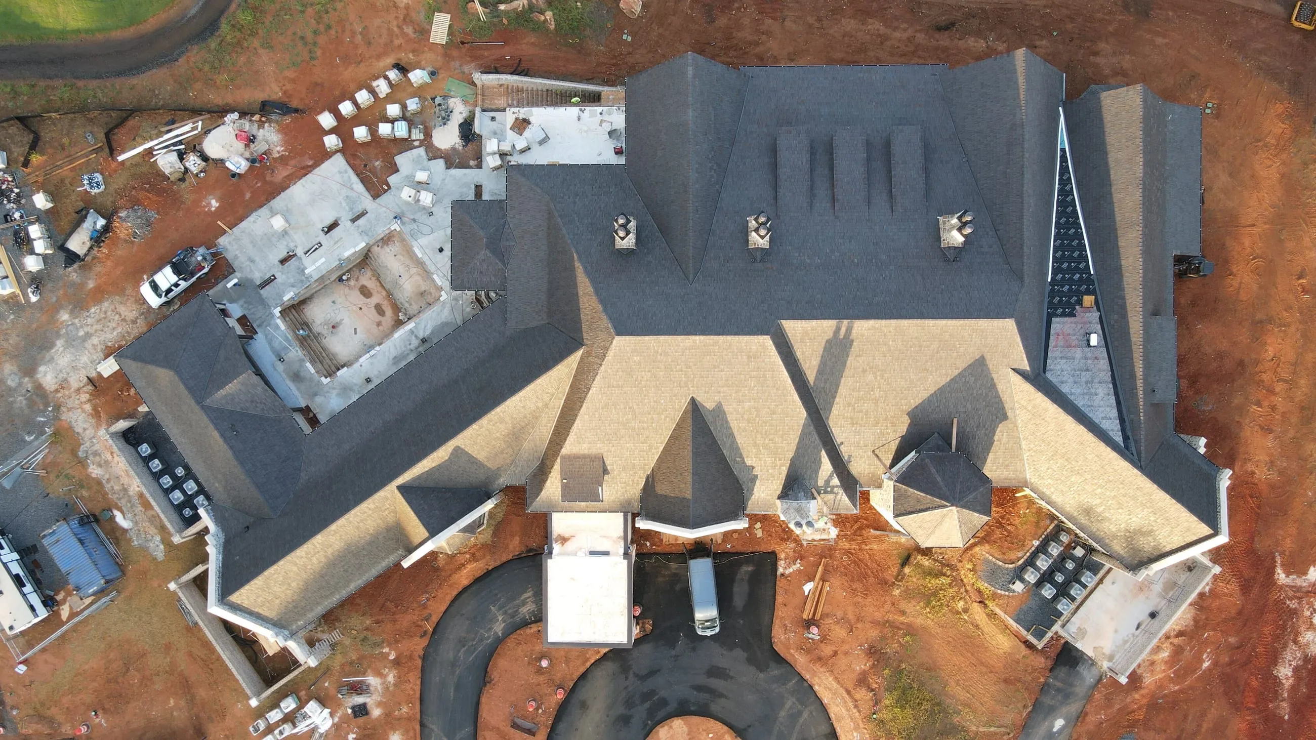 Private club clubhouse under construction: overhead aerial of the roof and the circular entry court