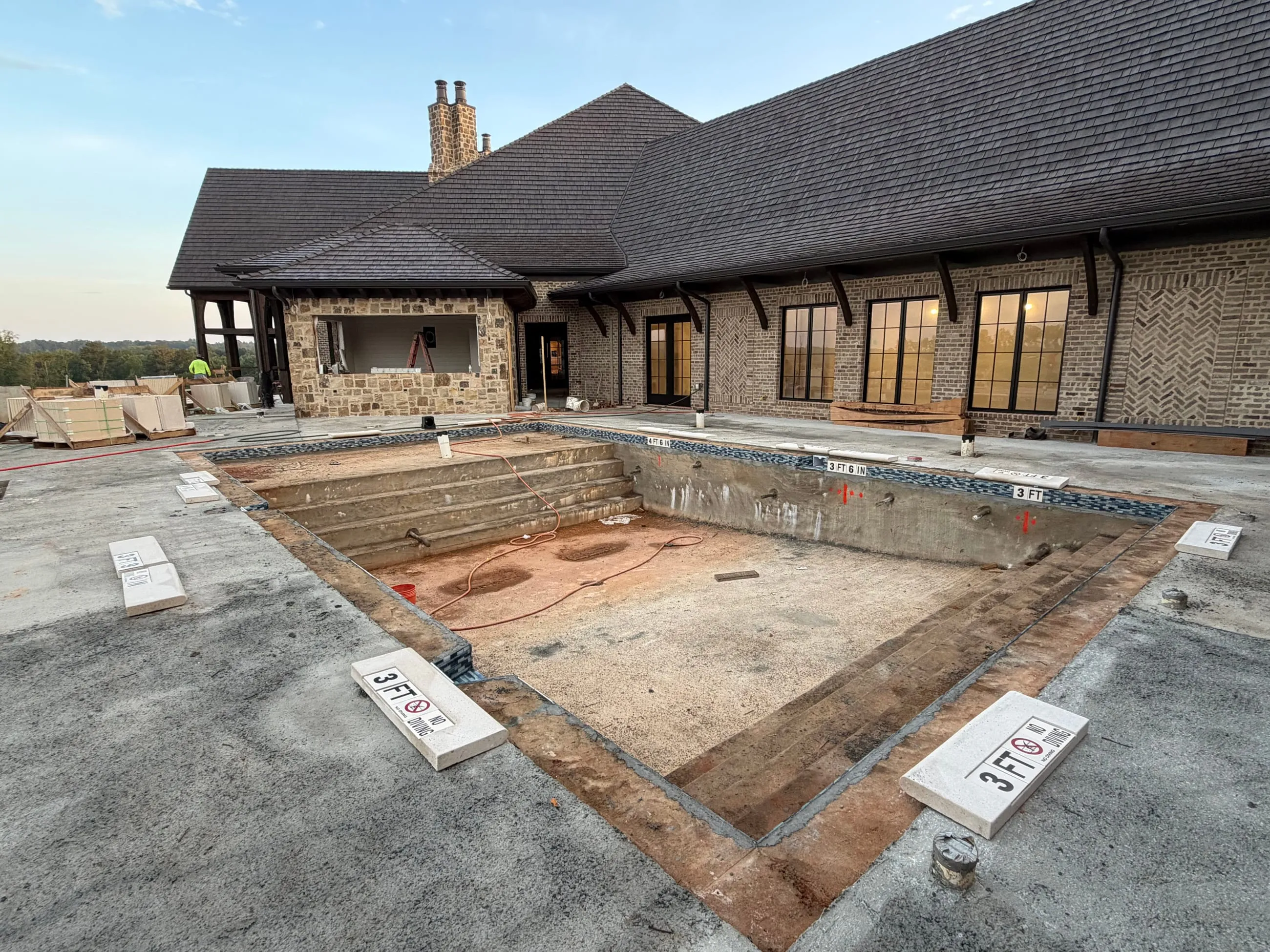 Private club pool under construction, the empty basin and its surround before finishes go down